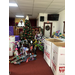 A Christmas tree stands in a church with bicycles and skateboards beneath it