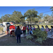 a line of children outside and Santa 